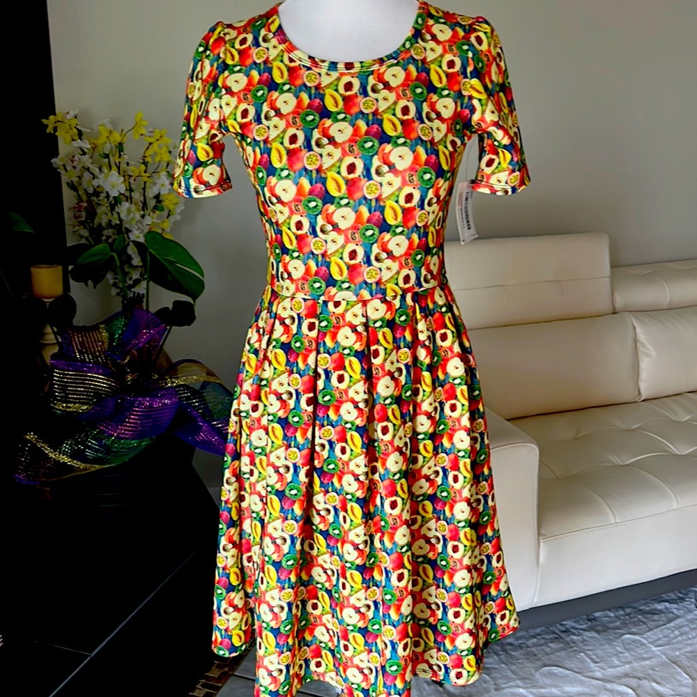 Cute as a button. Amelia dress with apples 🍏🍎🍐🍊and kiwi.